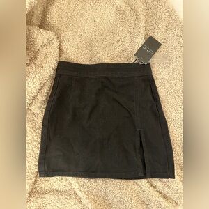 The Lola Mini Skirt size XXS in black NWT